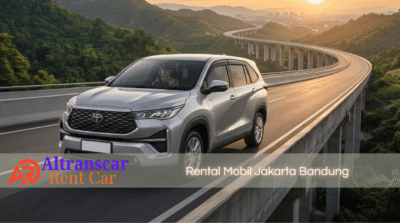 Mobil Innova Zenix silver Altranscar Rent Car melintas di jalan tol layang saat sunset, layanan rental mobil Jakarta Bandung dengan supir profesional.