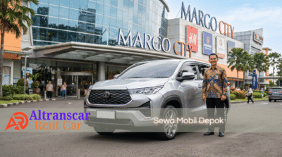 Supir Altranscar Rent Car berseragam batik siap melayani sewa mobil Depok dengan Innova Zenix silver di depan Margo City.