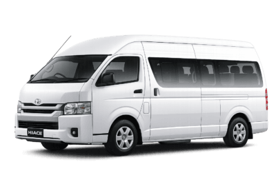 Toyota Hiace Commuter Luxury putih tampak serong depan dan samping untuk layanan sewa Hiace Luxury Jakarta dengan driver profesional